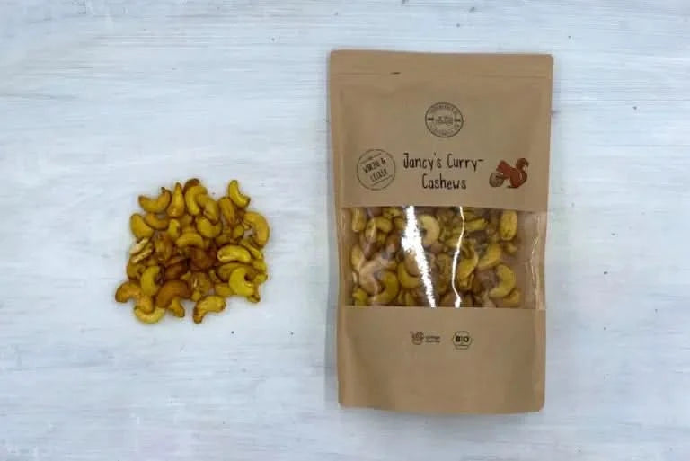 Jancy’s Curry Cashews Bio